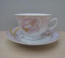 Pink ceramic coffee cup and saucer